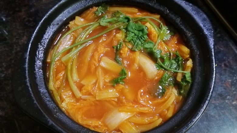 Tomato hot pot base, baby cabbage and pork ribs stewed in a pot