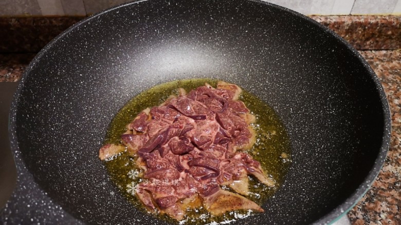 Stir-fried pork liver with garlic sprouts