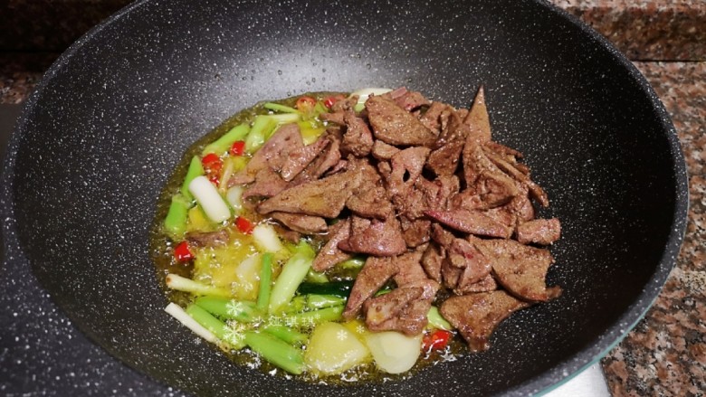 Stir-fried pork liver with garlic sprouts