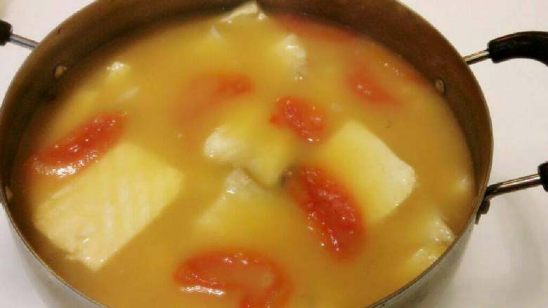 Tomato, tofu and fish fillet soup