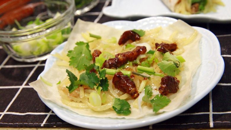 Spring pancakes rolled with shredded potatoes