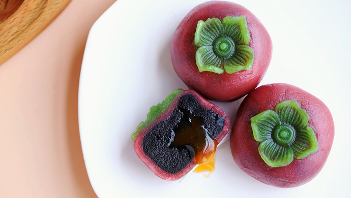 Creamy custard, black sesame and persimmon mooncakes