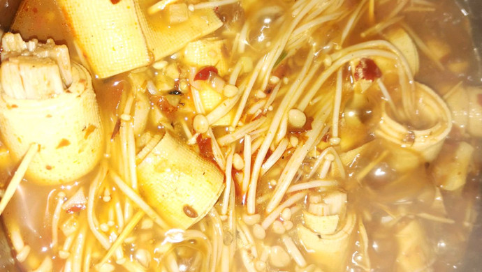 Enoki mushrooms rolled in tofu skin