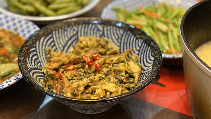 Fried local eggs with Chinese toon